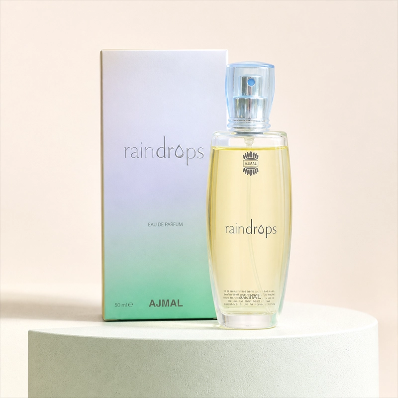 ادکلن زنانه Ajmal Raindrops Eau De Parfum حجم 50 میل با جعبه، روی استند سفید